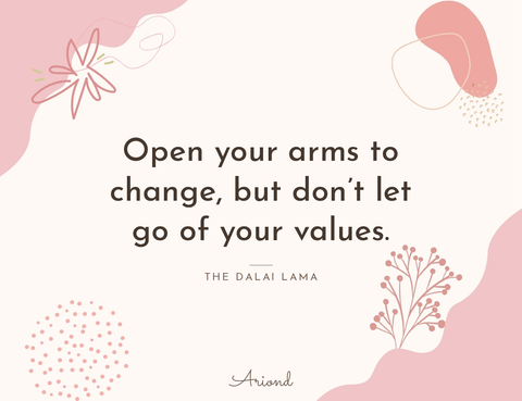 Quote card reading “Open your arms to change, but don’t let go of your values.” — The Dalai Lama, on a summer floral background