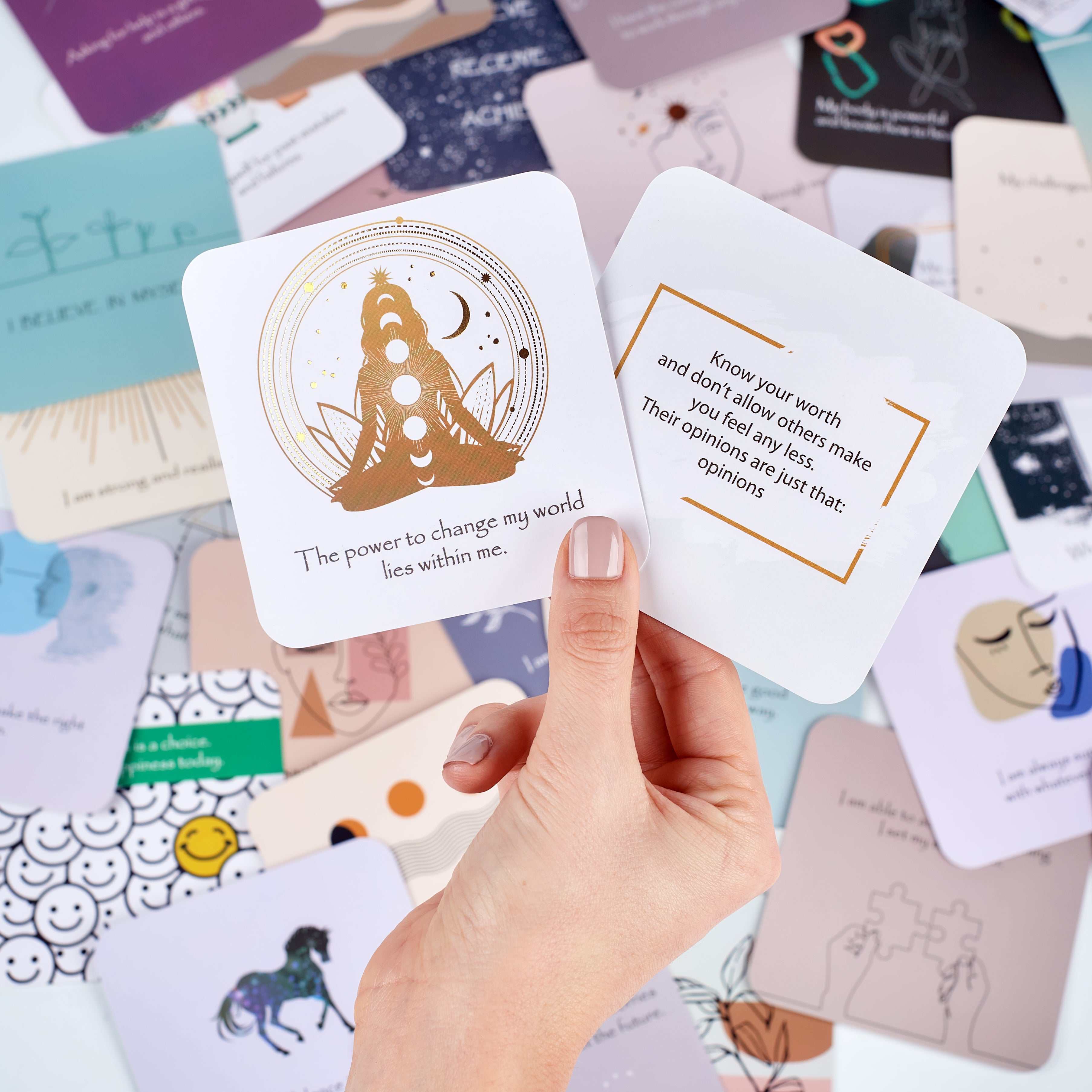 Happier Me Affirmation Cards Displayed Over many Affirmation Cards